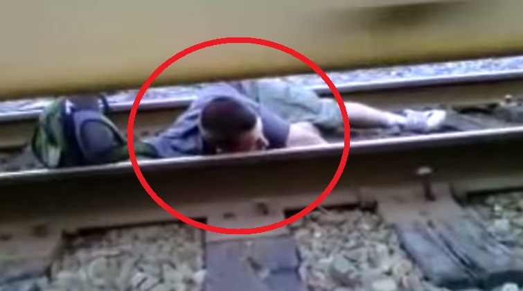 “Dont Ever Do This”, This Guy Lays Under The Moving Train