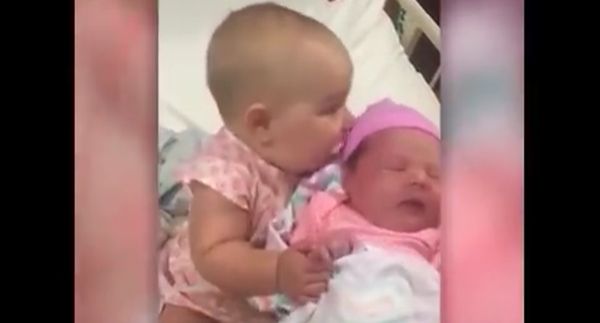 This Little Girl Couldn’t Get Enough Of Her Baby Cousin- So Adorable