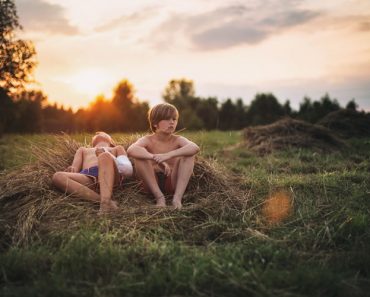 Kids Resting on Hay
